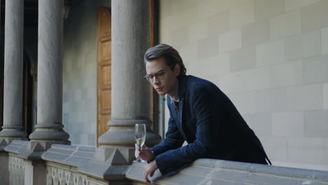 young man drinking champagne