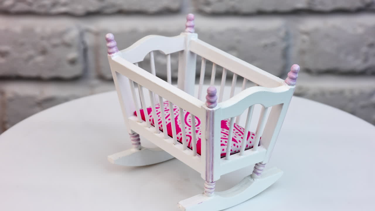 Miniature white bedroom sleepping interior. Small white bed toy for doll.