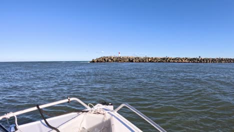 boat moving towards a jetty in gold coast