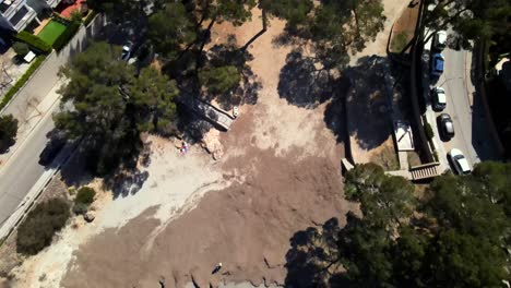 Experience a breathtaking aerial perspective of Santa Ponsa, showcasing its serene beach and rocky coastline. Clear waters and natural beauty attract visitors to this Mallorca gem.