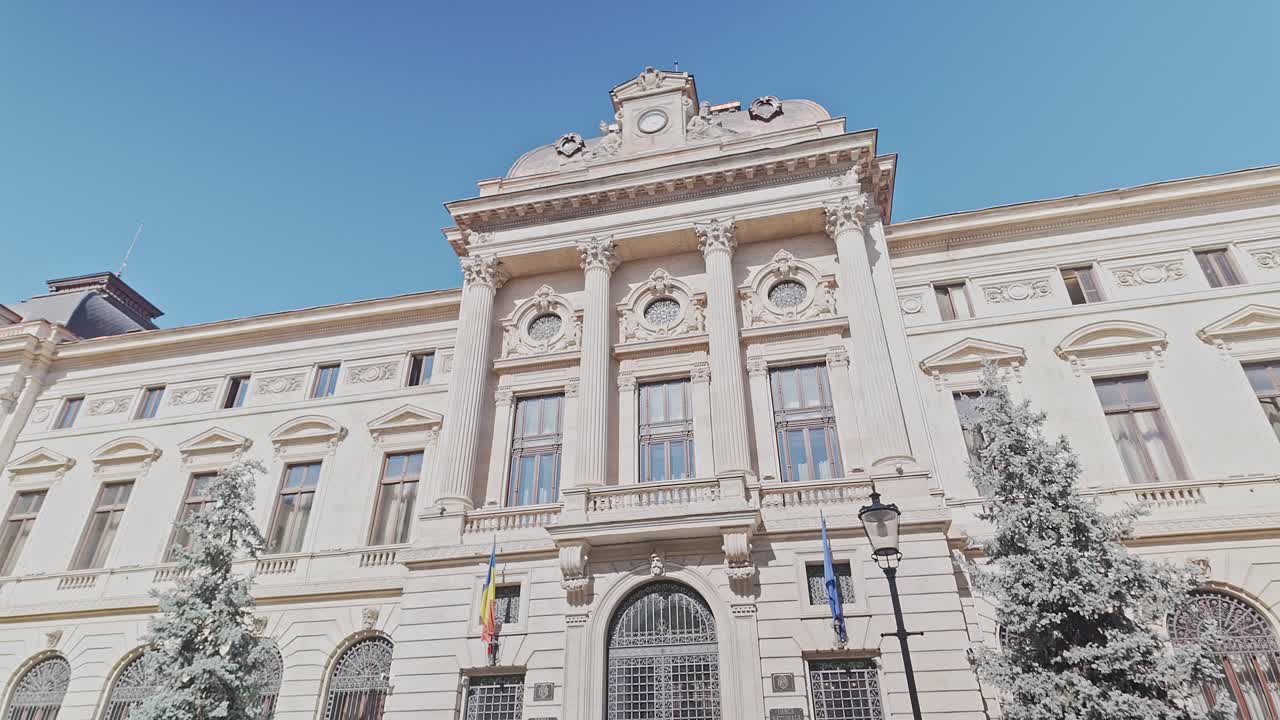 Pan shot over front facade of National Bank of Romania Bucharest