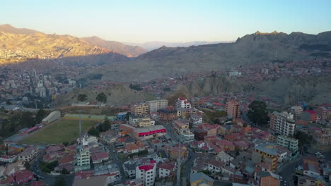 cable cars travel across la paz, bolivia in a scenic, sunset aerial view of the city
