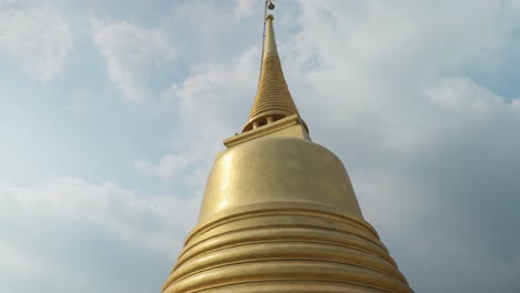 4K-Cinematic-travel-footage-of-the-top-of-Wat-Saket-temple,-the-Golden-Mount-in-Bangkok,-Thailand-on-a-sunny-day