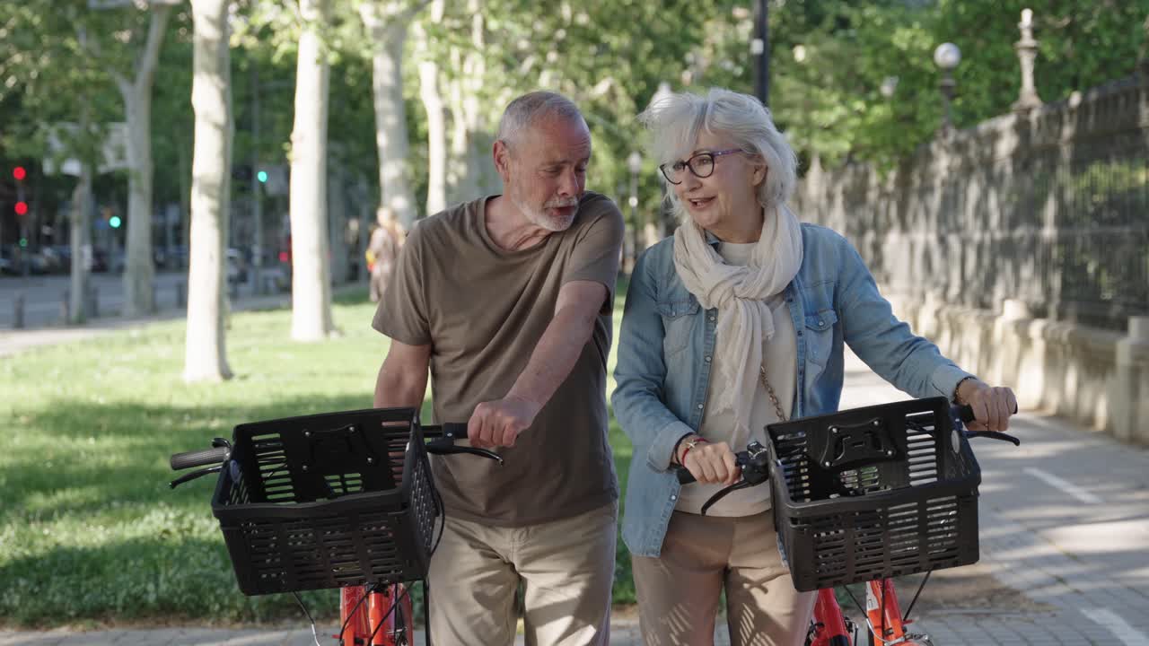 Elderly Couple Enjoying a Bike Ride in the Park