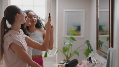 happy-teenage-girls-taking-photos-in-bathroom-posing-making-faces-enjoying-hanging-out-together-having-fun-sharing-sleep-over-on-social-media