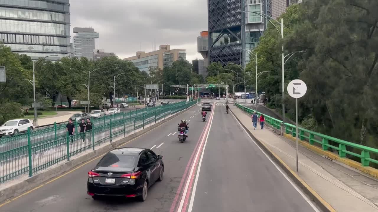 Slow motion shot in mexico city at the entrance of Chapultepec and finance district at morning