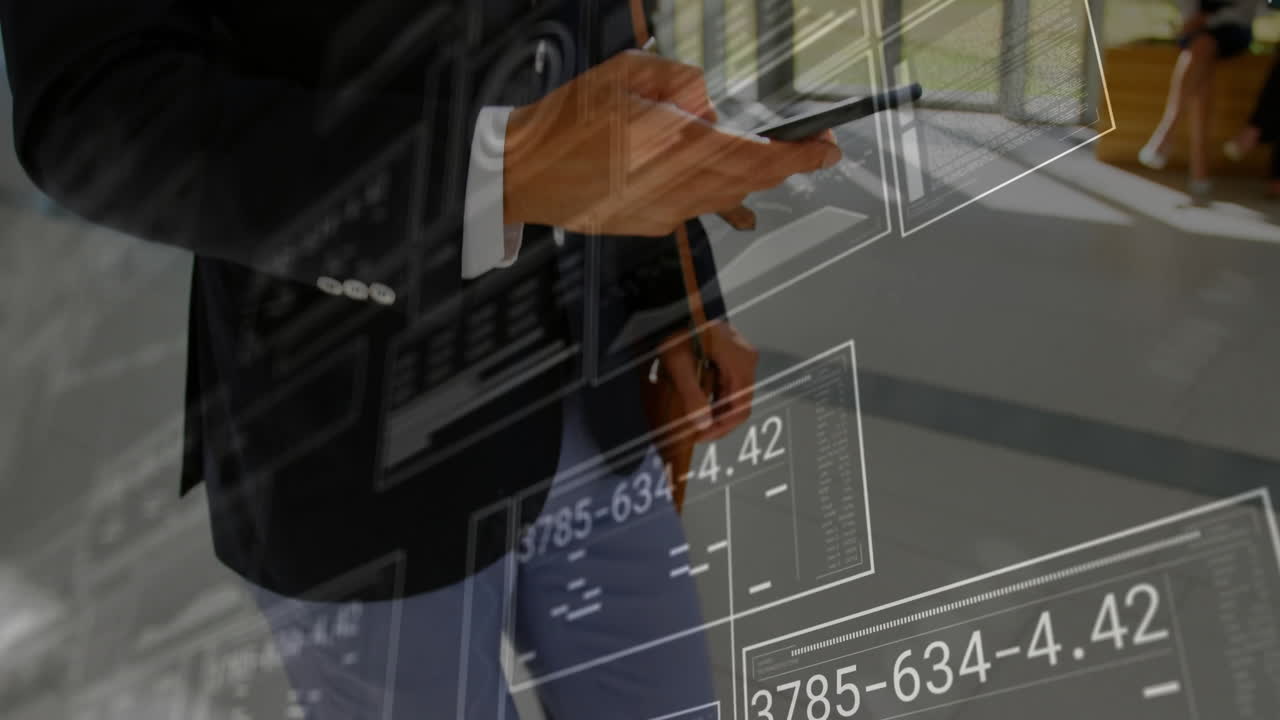 Businessman using smartphone in modern office corridor, displaying floating tech data graphics