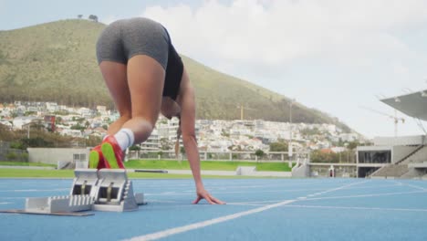 Caucasian-athlete-running-in-stadium