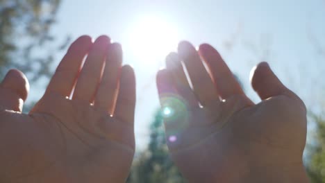 a person raises hands towards the sky and makes a prayer, a muslim prayer concept