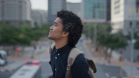 portrait professional young mixed race business man smiling enjoying successful urban lifestyle in city independent male entrepreneur afro hairstyle slow motion