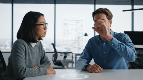 business meeting with holographic blueprint