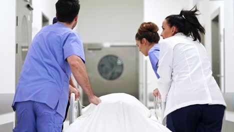 team of doctors running to the operating room