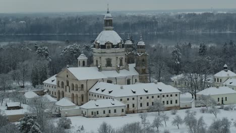 Aerial-view-of-Pažaislis-Monastery-covered-in-white-snow