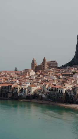 vertical aerial view of cefalu, an ancient italian town along the mediterranean sea coast of sicily island.