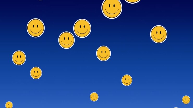 Digital animation of multiple smiling face emojis floating against blue background