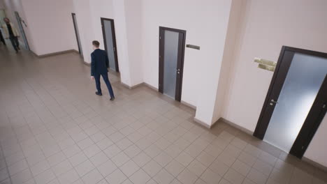 modern office hallway with people walking and empty scenes