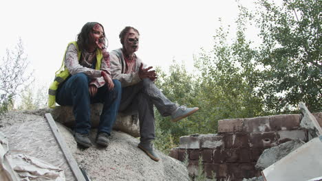 zombies sitting outdoors