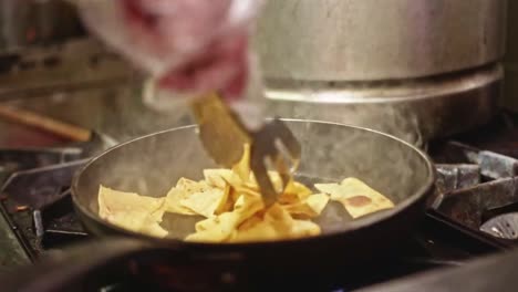 Pouring-flipping-frying-Nachos-in-a-health-Vegan-Mexican-Kitchen