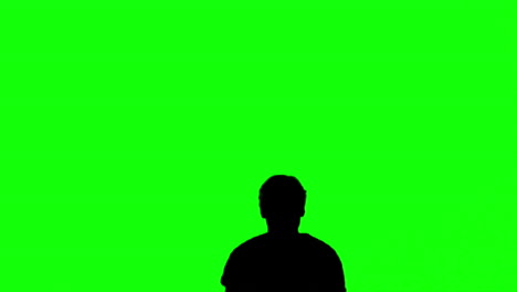 silhouette of a man jumping with raised arms on green screen