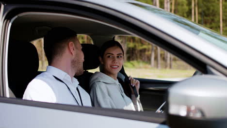 driving school teacher with student