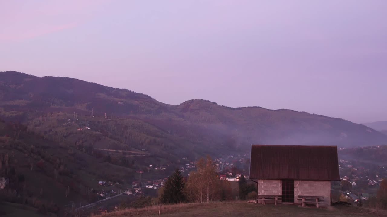 Scenic View Of Ridges With Tranquil Village During Misty Morning In Piatra Craiului Mountain, Brasov County, Romania, Panning Right Shot