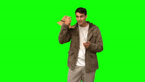 Lost-man-using-his-compass-on-green-screen