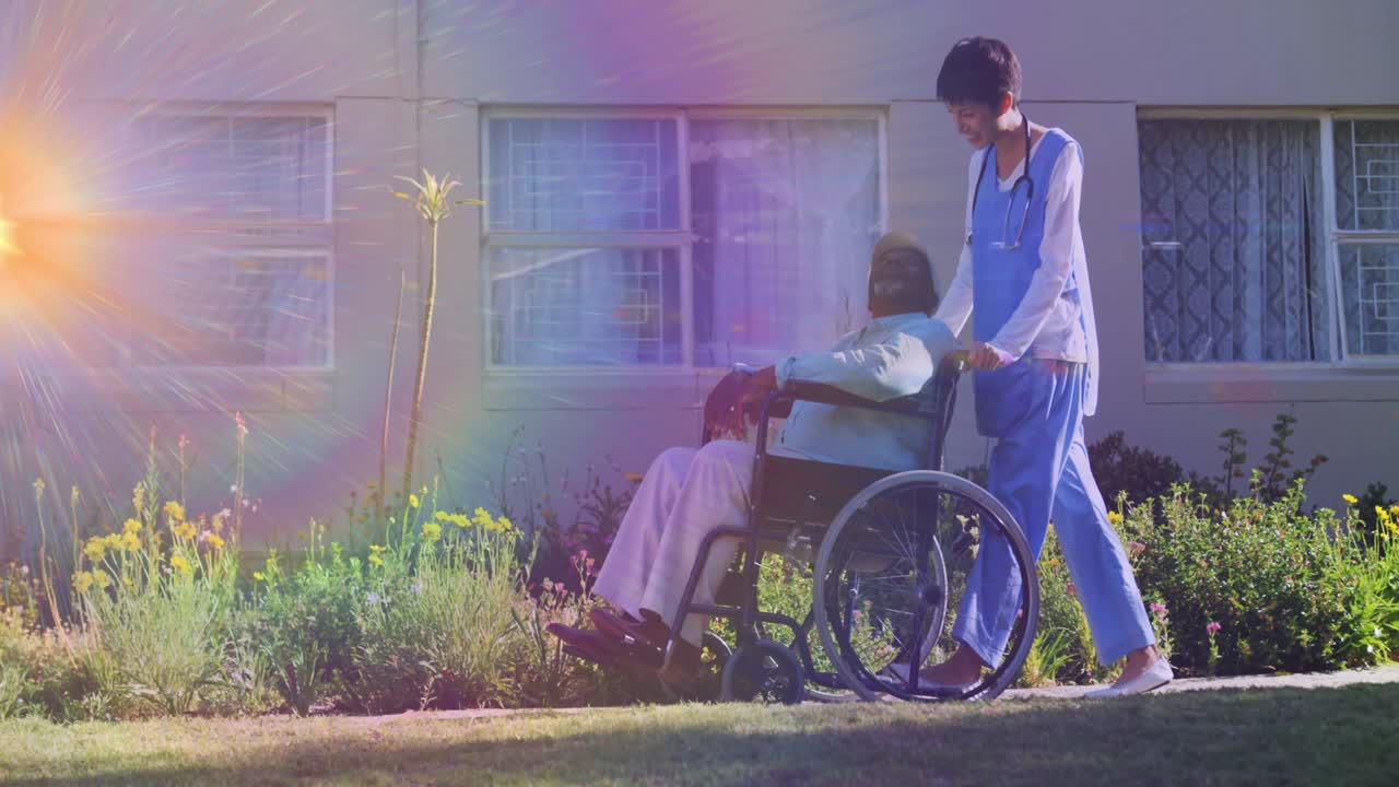 Animation of light moving over nurse wheeling senior man in wheelchair
