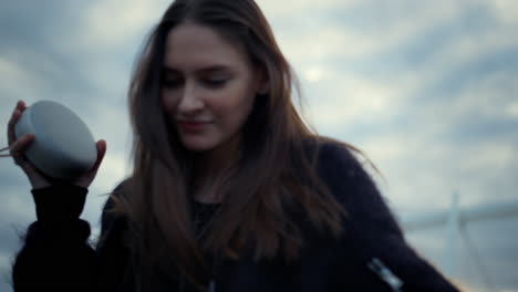 smiling woman dancing on the street