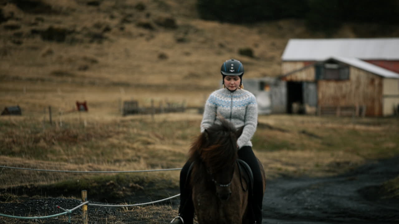 Woman Riding an Icelandic Horse in Rural Iceland