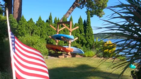 a-woman’s-hand-is-waving-US-flag-at-4th-July,-stars-and-stripes