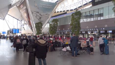 interior of new modern terminal at lech walesa airport in gdansk. arrival departure board at the terminal.people waiting in the terminal