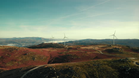 wind turbines at mountain top in portuguese countryside