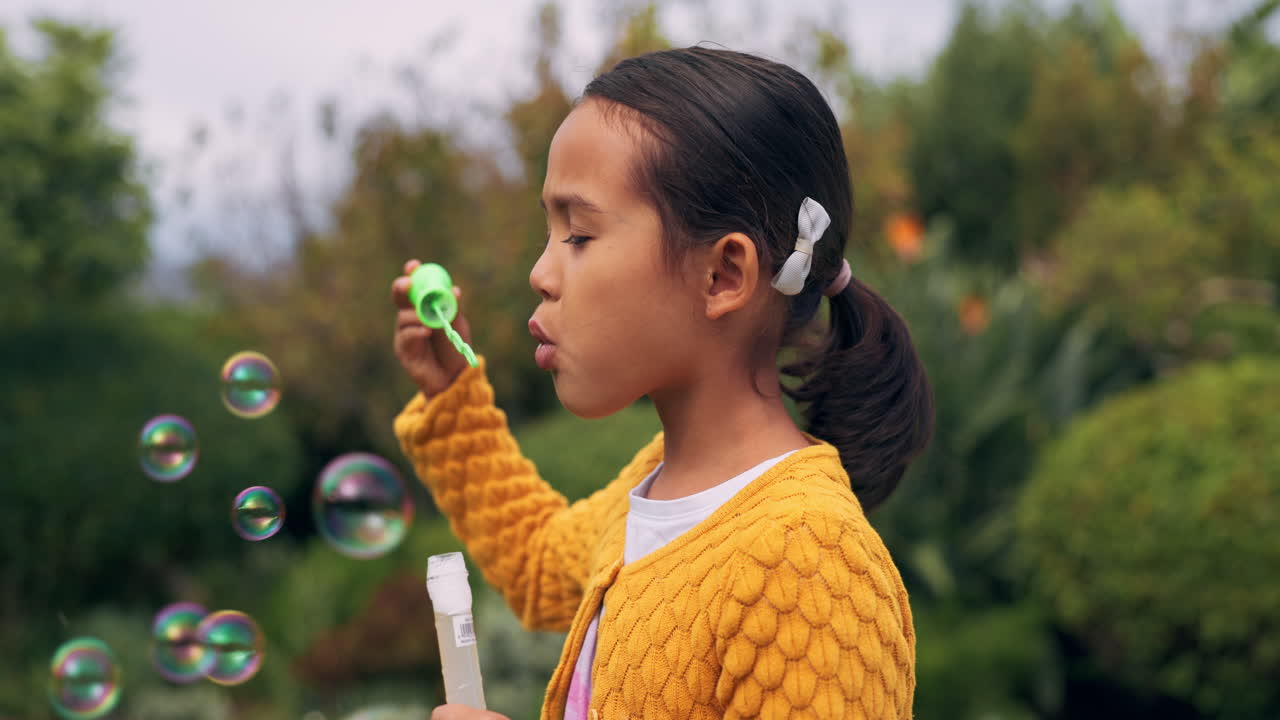Park, child and girl blowing bubbles