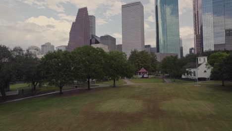 Aerial---Reveal-of-Downtown-Houston-from-Sam-Houston-Park