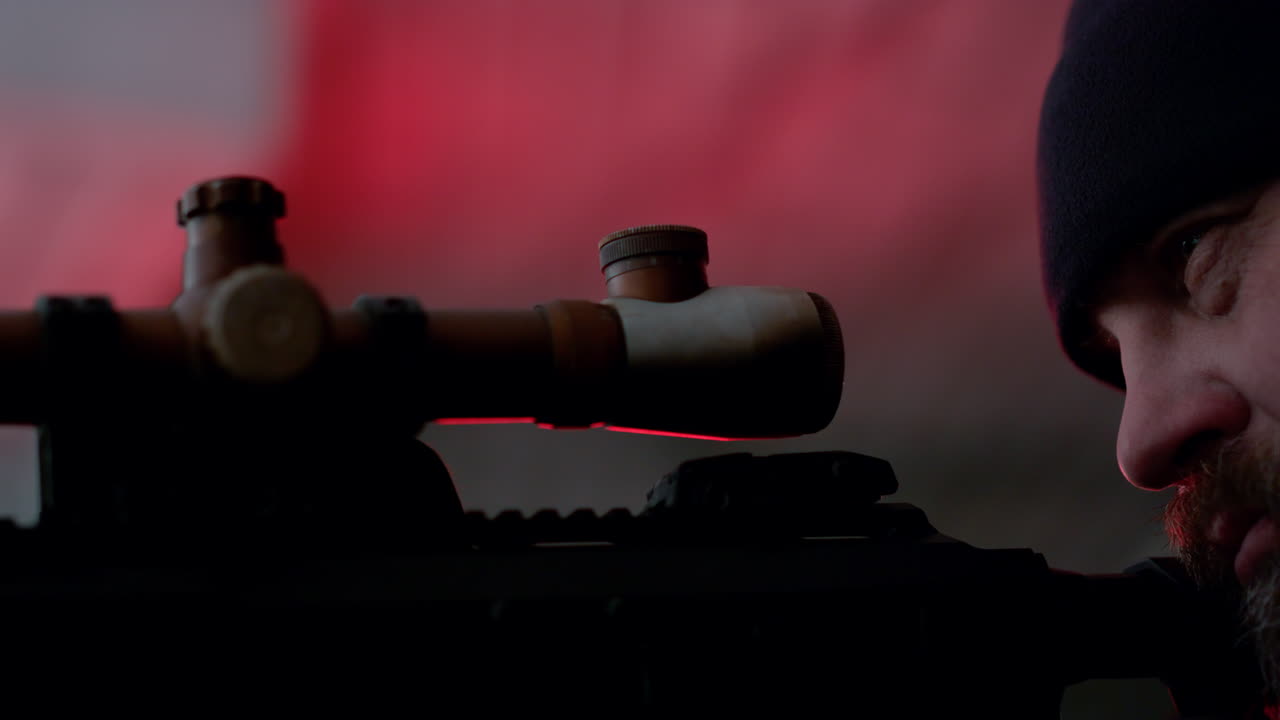 Hitman holding modern rifle. Professional sniper aiming target on firearm