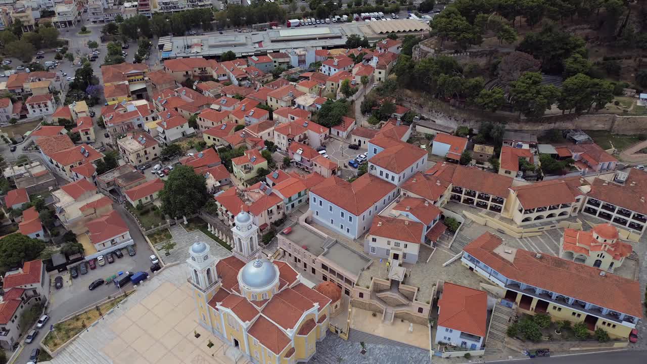 Aerial, push out raise up, establishing shot of historical center of Kalamata, Ypapanti cathedral church and Ancient Castle in frame 4K