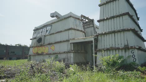 close-up view, strange structural construction, graffiti, vegetation