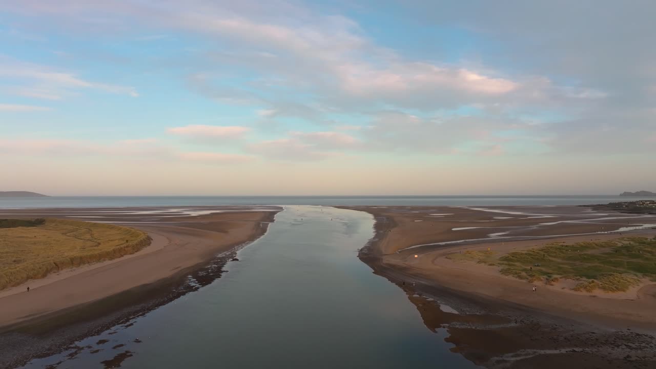 4K cinematic drone footage capturing Malahide Beach, during golden hour, with warm sunset Co.Dublin - Ireland_02