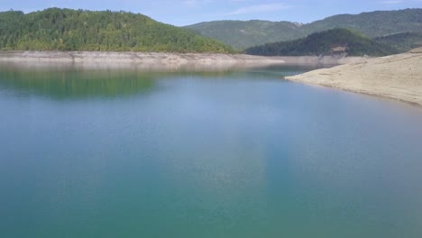 Incredible-aerial-4k-ascending-shot-revealing-Lake-Zaovine-and-Tara-mountain-in-Serbia