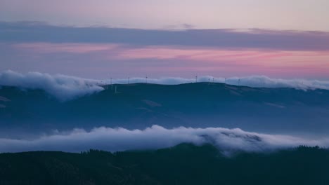 Wind-power-turbines-using-the-power-of-nature-to-create-green-energy-during-the-sunset