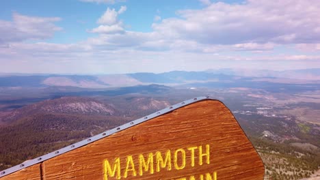 close-up gimbal shot booming up of the elevation sign at the summit of mammoth mountain in california