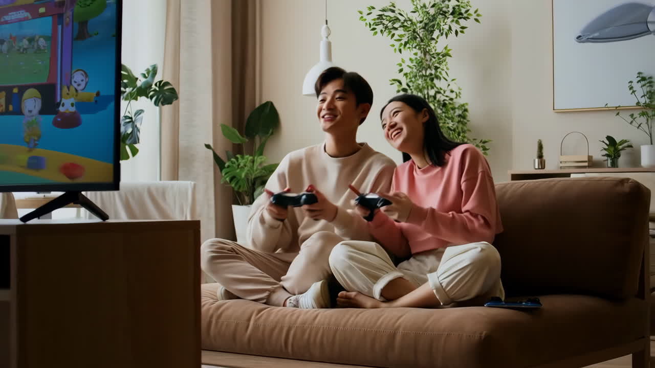 Happy Couple Playing Video Games Together at Home