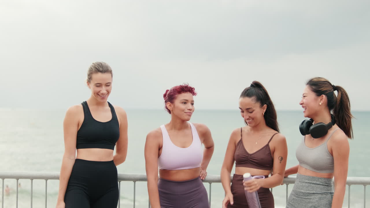 Friends Laughing Together After Beach Workout