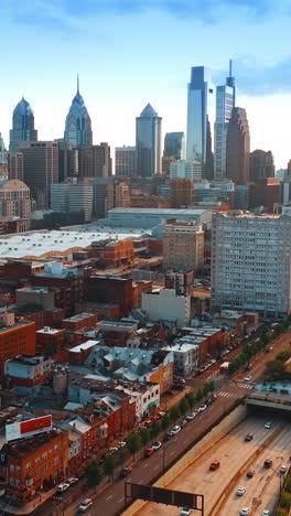 philadelphia vine street expressway view in the rays of setting sun. colorful panorama of the city from air. vertical video