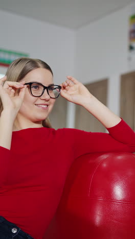 young woman trying eyeglasses. portrait of happy young woman buying new glasses at optician store