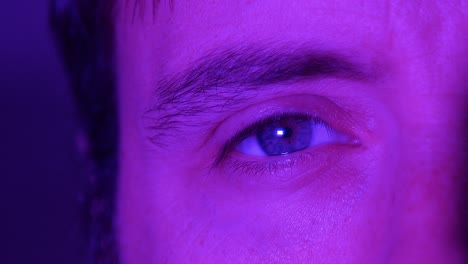 Portrait-of-Adult-Male-Persons-Eye-in-Purple-Filter-Lighting