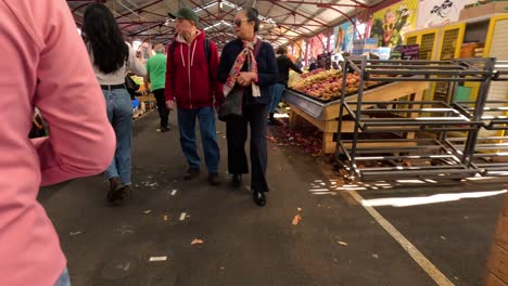 shoppers walking through market stalls in melbourne