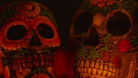 close up on still life of decorated skulls celebrating mexican holiday of dia de muertos or day of the dead 2