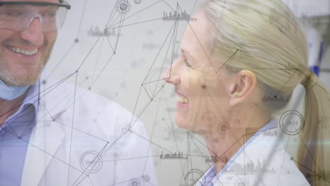 animation of network of connections over caucasian male and female dentist smiling at clinic