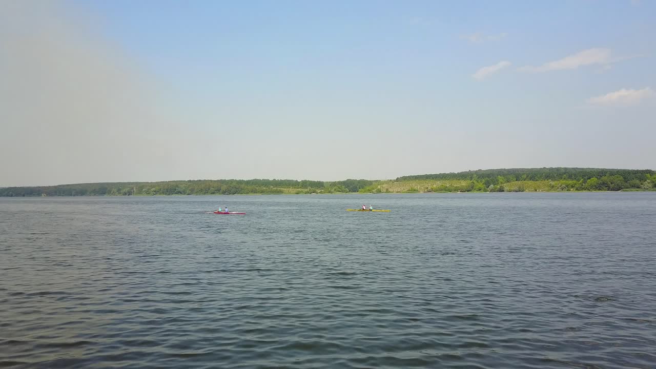 Kayakers Training On Canoe. Active children training in kayak on the river